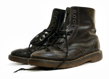 A pair of old black worn out work boots clipart