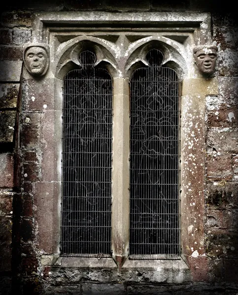 Caras de piedra gótica — Foto de Stock