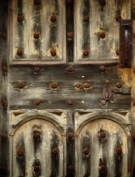 stock image Old rusty wooden gothic door detail