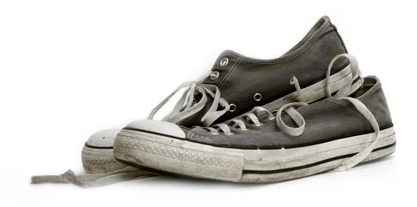 Старі вживані та зношені кросівки — стокове фото