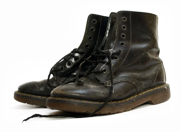 stock image A pair of old black worn out work boots