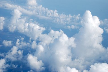 The blue sky with clouds. A background