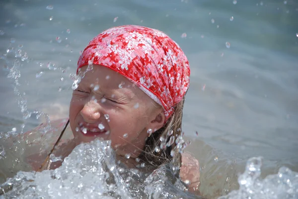The girl in water splashes — Stock Photo, Image
