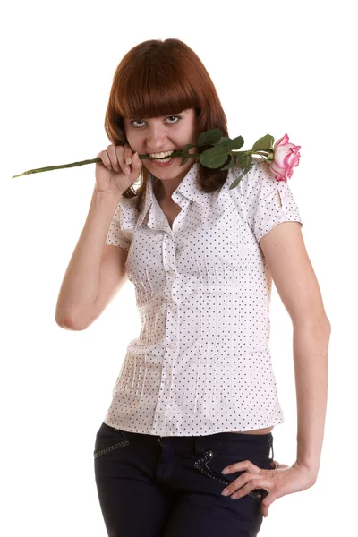 Το κορίτσι με ένα τριαντάφυλλο σε ένα δόντια. — Φωτογραφία Αρχείου