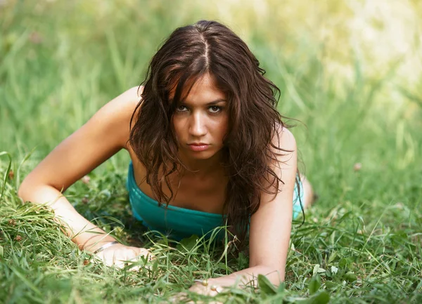 The beautiful girl on a green grass — Stock Photo, Image