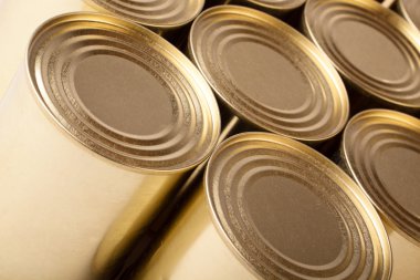 Tinned food. Row of metal cans with no label clipart