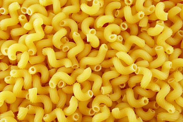 Elbow macaroni background — Stock Photo, Image