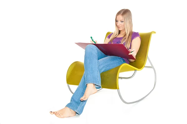 stock image Woman on chair taking notes