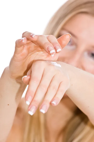 Woman creaming hands — Stock Photo, Image