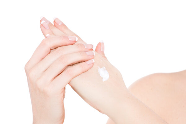 Woman creaming hands