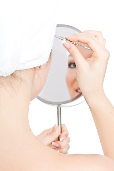 Woman makeup in mirror — Stock Photo, Image