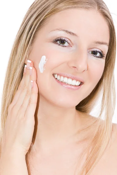 Woman creaming face — Stock Photo, Image