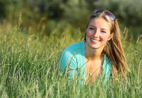 Blonde girl in grass — Stock Photo, Image