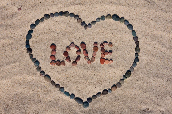 Love sign on sand — Stock Photo, Image