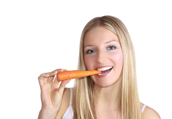 Женщина с морковью — стоковое фото