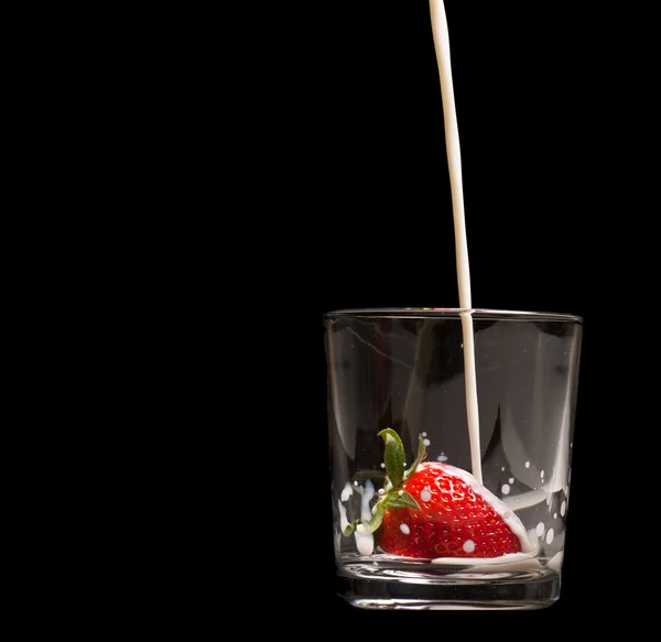 Strawberries in a glass on black — Stock Photo, Image