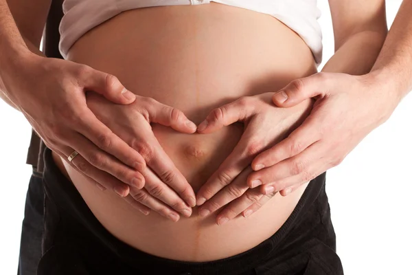 Zaawansowanej ciąży brzuch rękami — Zdjęcie stockowe