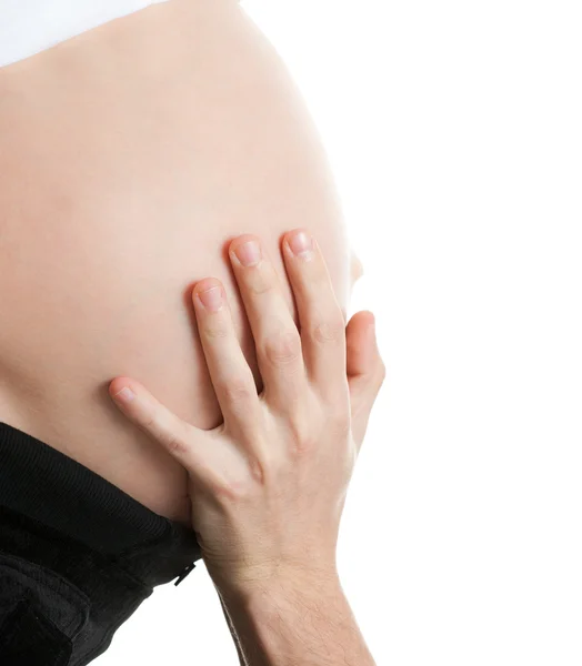 Vientre embarazada avanzada con las manos —  Fotos de Stock