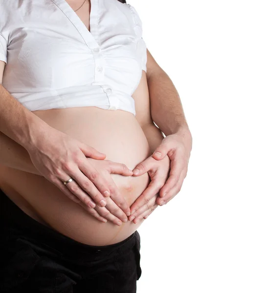 Barriga grávida avançada com as mãos — Fotografia de Stock