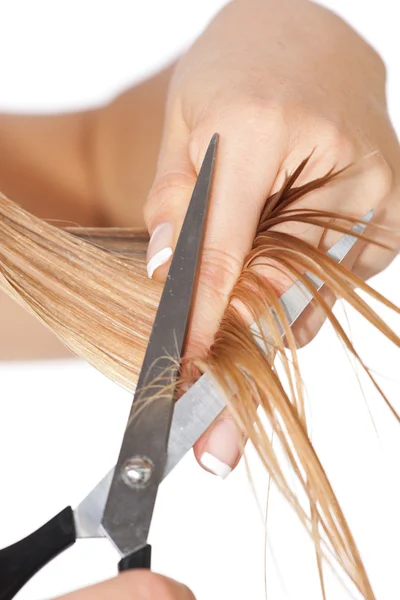 Žena stříhat vlasy — Stock fotografie