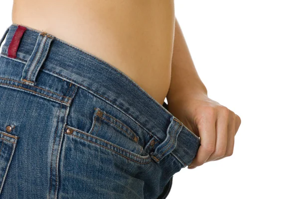 Žena v příliš velké džíny — Stock fotografie