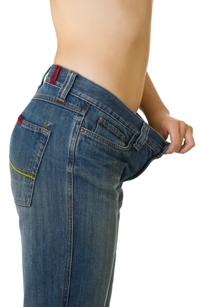 Kvinna i för stora jeans — Stockfoto
