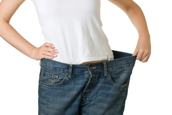 Kobiety w dżinsach zbyt duże — Zdjęcie stockowe