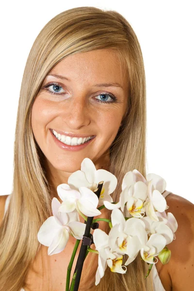 Mujer con flores de orquídea —  Fotos de Stock