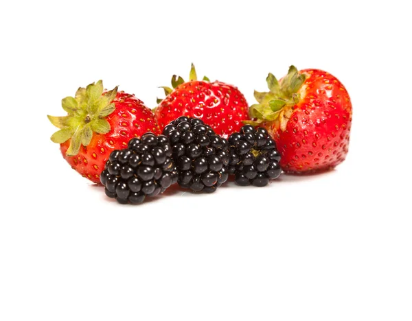Composition of ripe black and red raspberries and strawberries — Stock Photo, Image