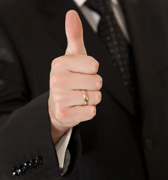Homem de negócios de terno polegares para cima no fundo isolado branco — Fotografia de Stock