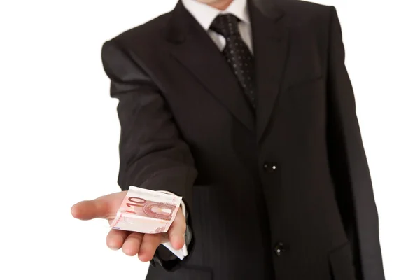 Obchodní muž drží peníze na bílém pozadí izolované — Stock fotografie