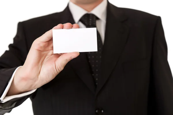 Ділова людина тримає порожню картку на білому ізольованому фоні — стокове фото