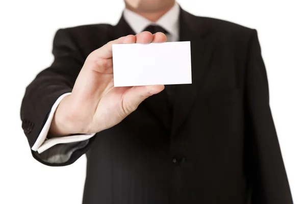 Деловой человек держит чистую карточку на белом изолированном фоне — стоковое фото