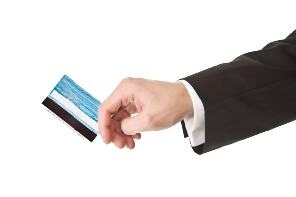 Чоловік у костюмі тримає кредитну картку — стокове фото