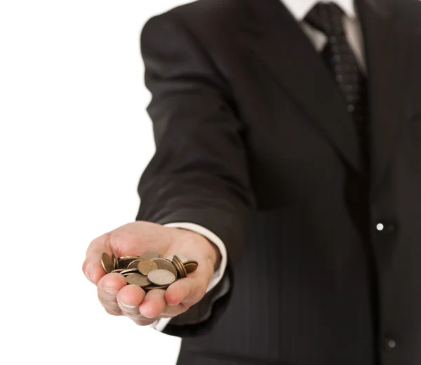 stock image Male hand in suit holding coins on white isolated background