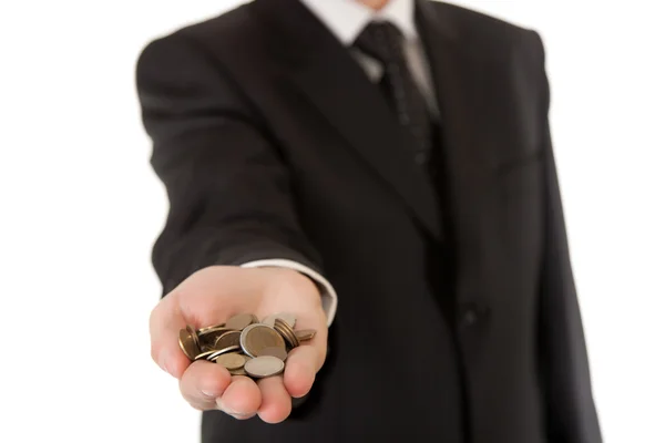 Mannenhand in pak houden munten op witte geïsoleerde achtergrond — Stockfoto