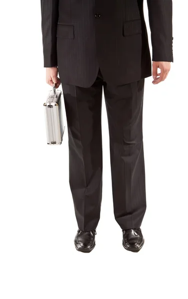 Man in pak bedrijf zilver koffer op witte geïsoleerde achtergrond — Stockfoto