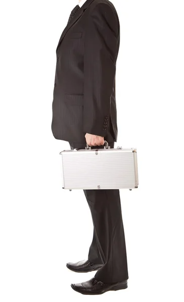 Man in suit holding silver suitcase on white isolated background — Stock Photo, Image