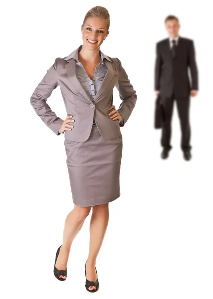 Mulher de negócios com homem de negócios no fundo — Fotografia de Stock