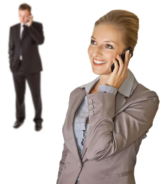 Business woman with businessman in background — Stock Photo, Image