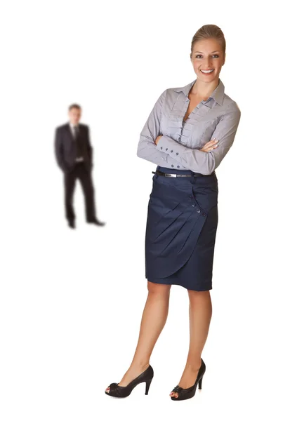 Donna d'affari con uomo d'affari in background — Foto Stock