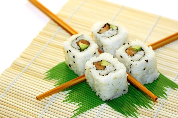 stock image Sushi Rolls structured over white