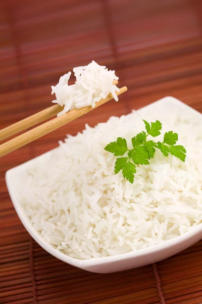 stock image Bowl of rice on mat