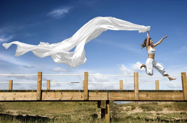 Jumping with a scarf — Stock Photo, Image
