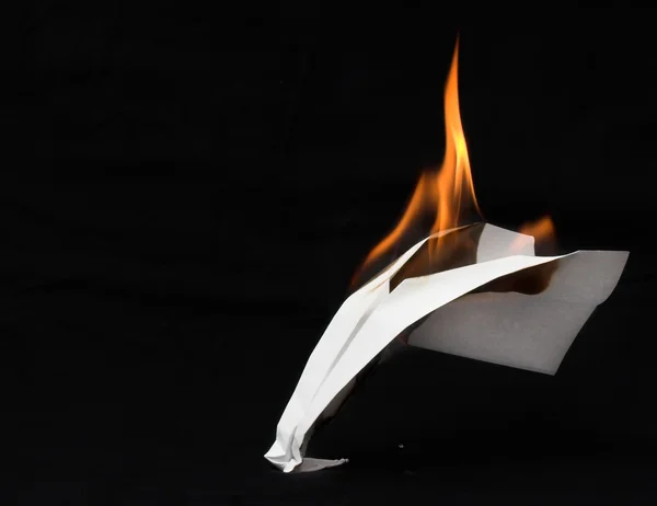Paper airplane in flames — Stock Photo, Image