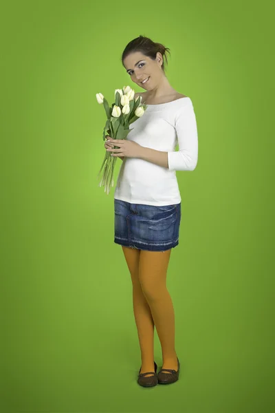 Menina feliz com tulipas — Fotografia de Stock