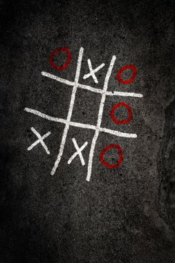 Noughts and Crosses game on paving clipart