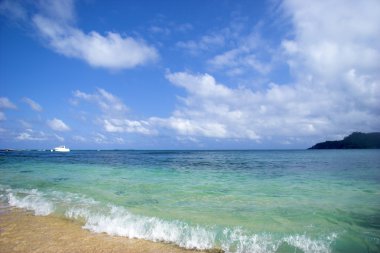 Beautiful beach with a great blue sky and turqoise water in Sao Tom clipart