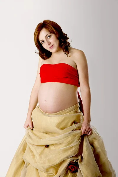 Mujer Embarazada Posando Blanco Con Hermoso Vestido —  Fotos de Stock