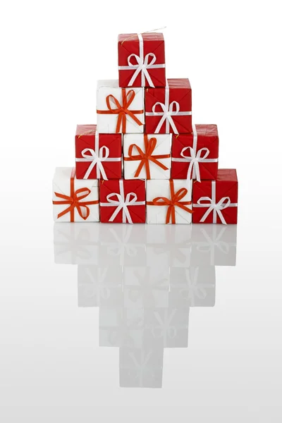 Pyramid Made Small Gift Boxes Isolated White Reflection — Stock Photo, Image